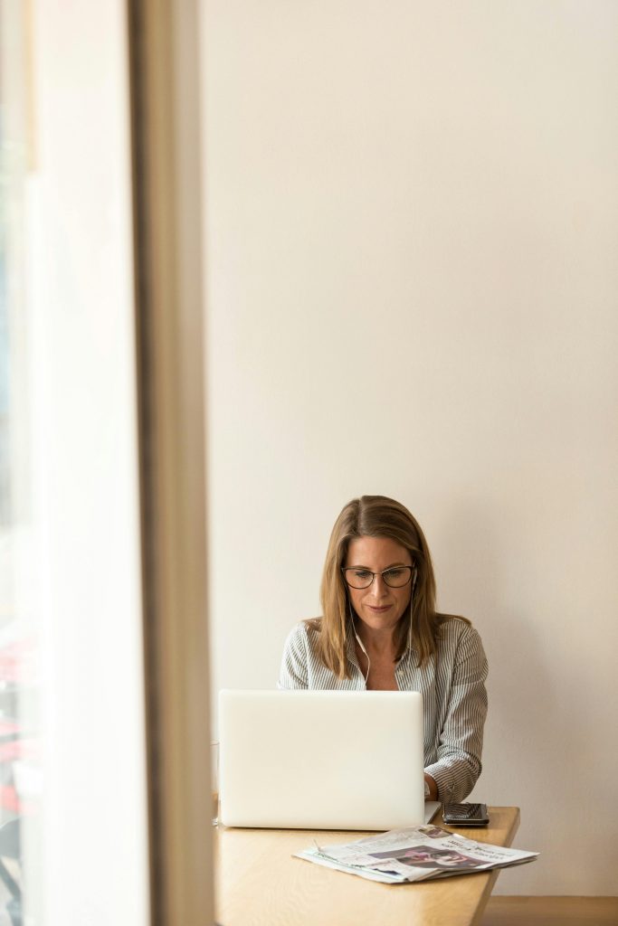 focused female working at a laptop