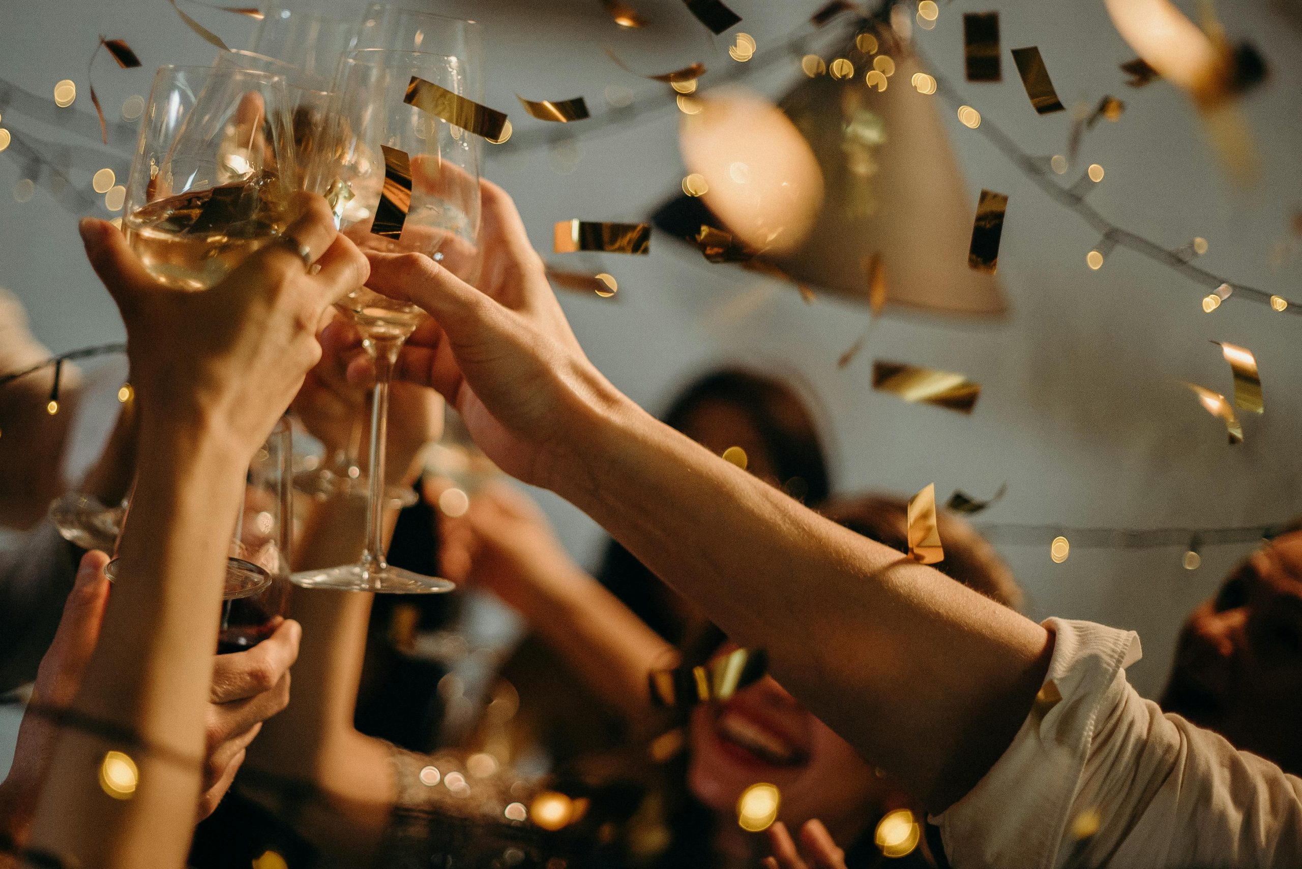 Confetti falls around a celebratory champagne toast