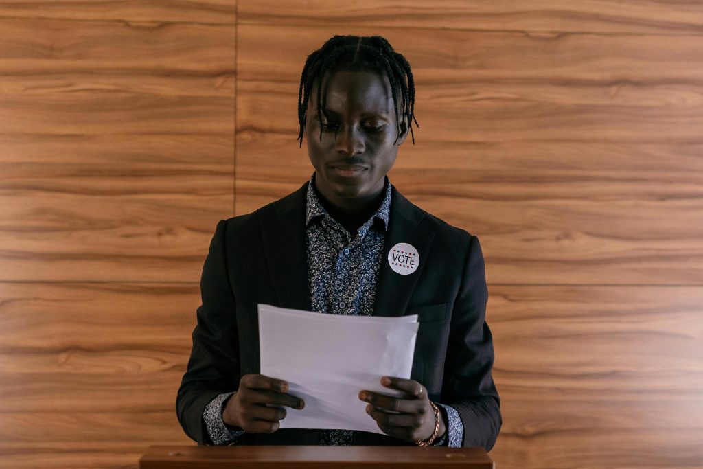 a candidate checks his notes before an electoral speech