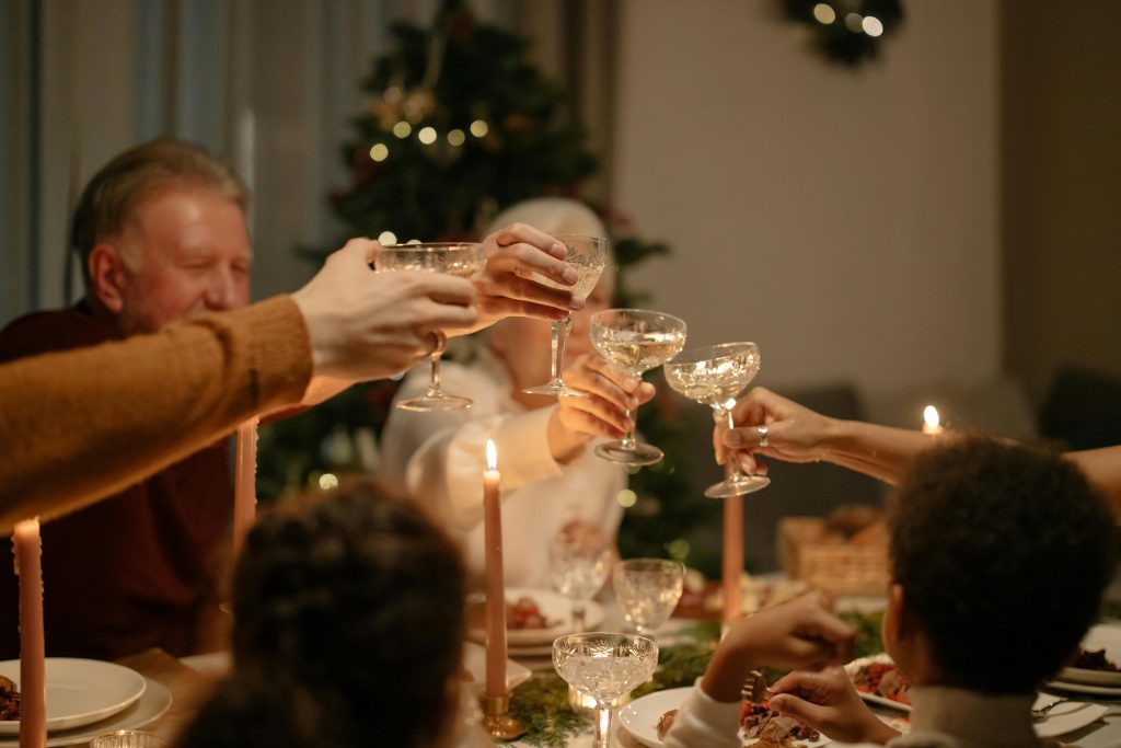 family toasting at the dinner table