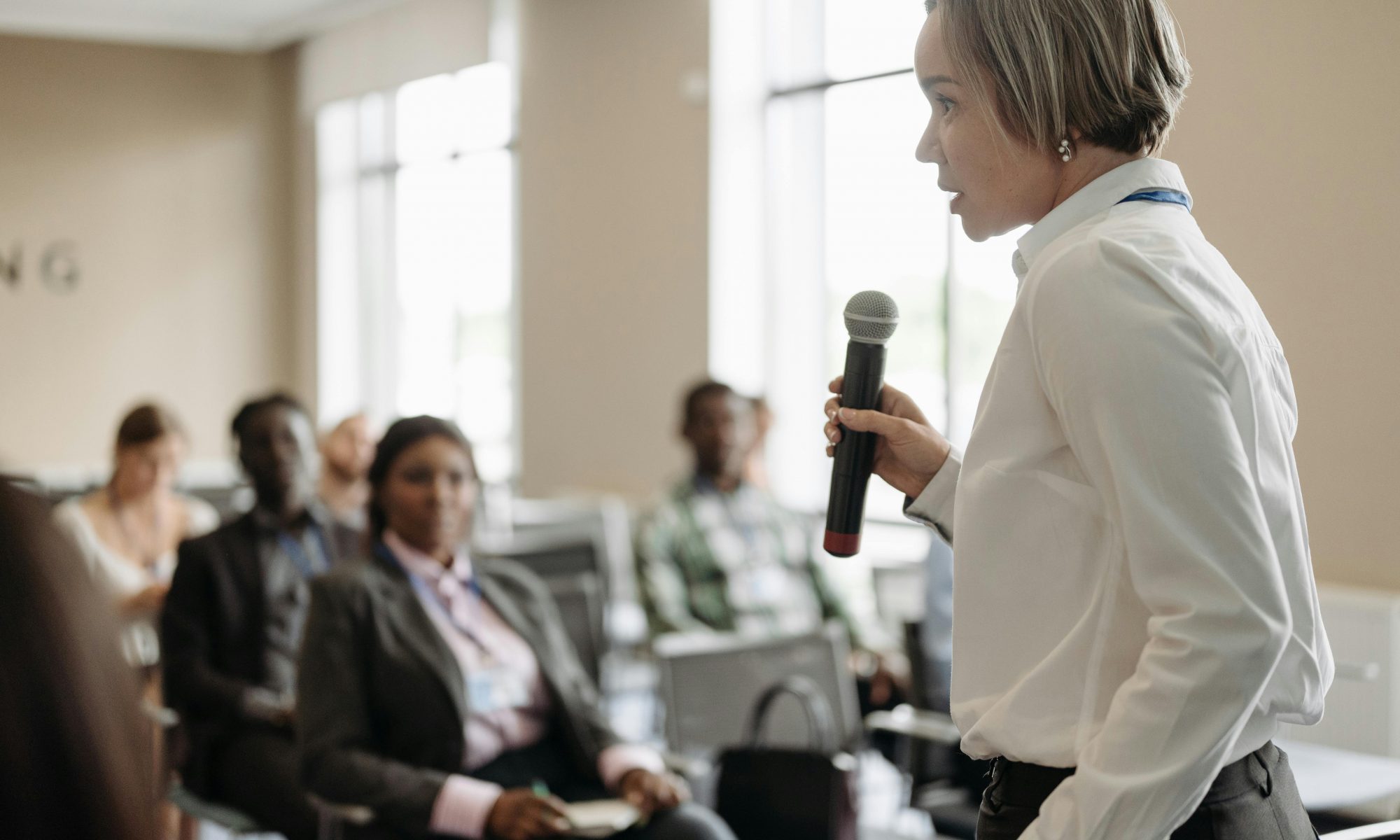 Female speaker holding the attention of a small crowd