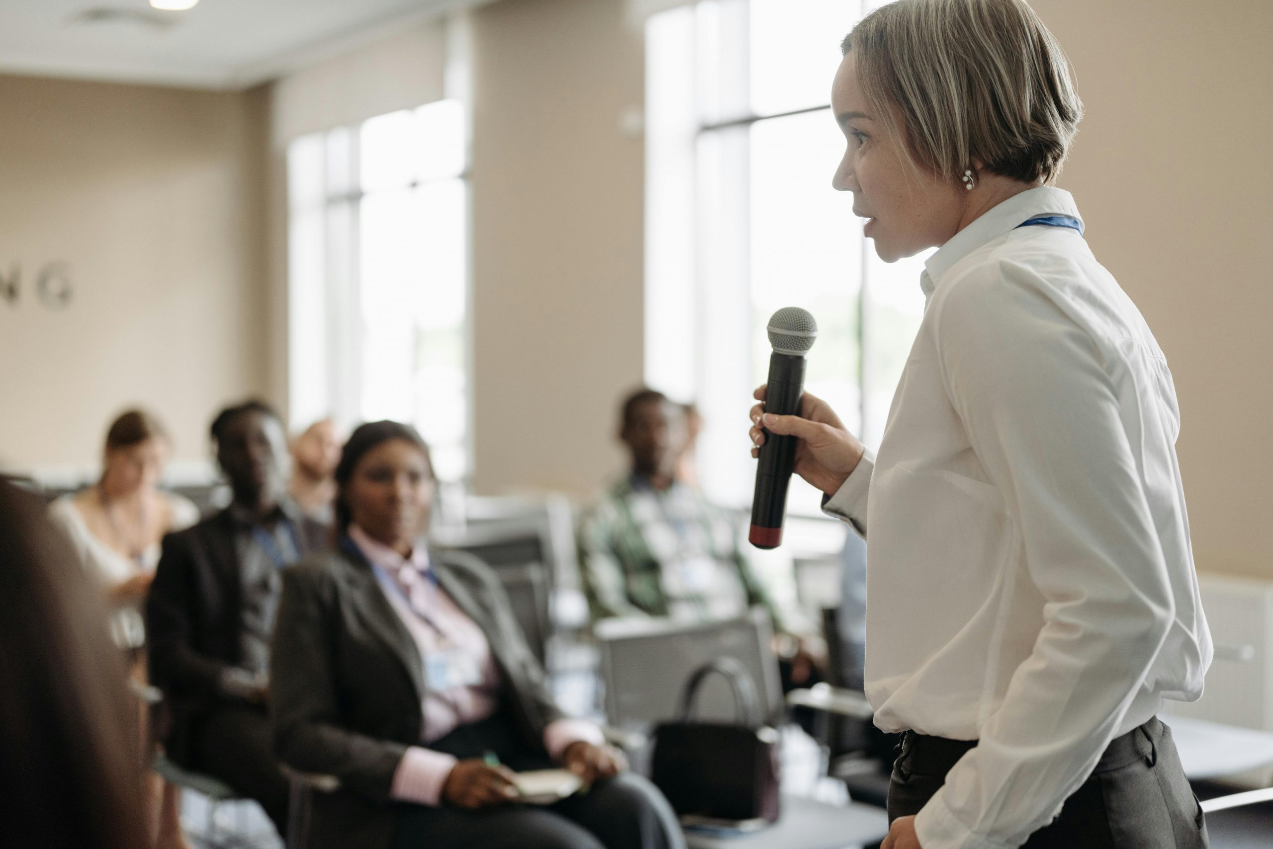 Female speaker holding the attention of a small crowd