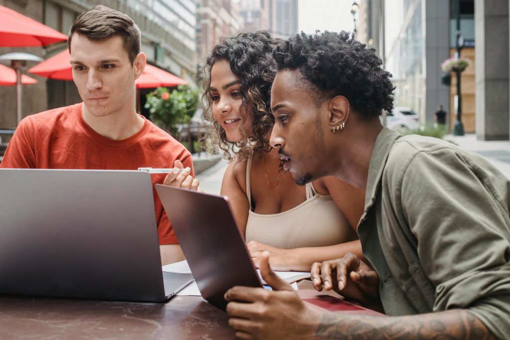 friends show each other new resources for writing essays online
